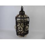 A Vintage Cast Iron and Glass Outdoor Wall Hanging Lantern with Bracket