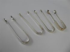 Four Silver Sugar Tongs