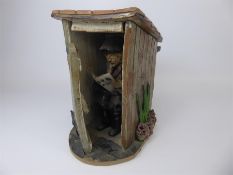 A Ceramic 'Geordie Netty-Style' Figure in an Outhouse