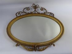 An Antique Oval Gilt Wood Mirror