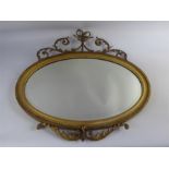 An Antique Oval Gilt Wood Mirror