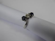 An 18ct White Gold, Diamond and Sapphire Ring.