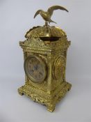 A Brass Mantle Clock With Bird Finial.