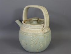 A Stone-ware Pale Blue Glazed Tea Pot and Cover