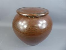 A Large Stoneware Kaki Glazed Pot and Cover