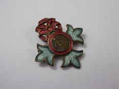A Lady's Silver and Enamel MBE Brooch