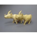 A Pair of Antique Carved Ivory Rhinoceros