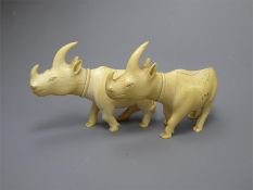 A Pair of Antique Carved Ivory Rhinoceros