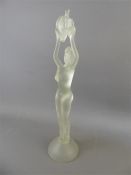An Opaque Glass Figurine of a Feminine Nude