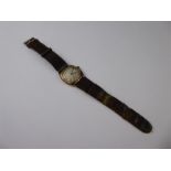 A 9ct Yellow Gold Gentleman's Wrist Watch, the watch having a white engine turned face with
