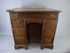 An Antique Oak Small Knee-hole Desk