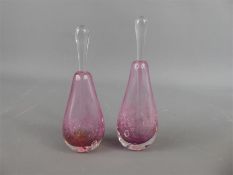 A Pair of Pink Glass Perfume Bottles with Stoppers