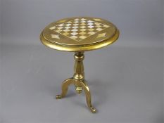 An Antique Brass Tilt-top Candle Mirror