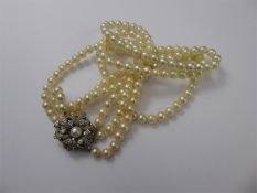 A Three-Strand Pearl Necklace