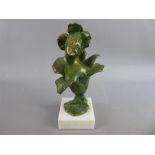 A Green-Bronzed Floral Figurine