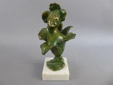 A Green-Bronzed Floral Figurine