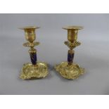 A Pair of Brass and Blue Enamel Candlesticks