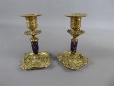 A Pair of Brass and Blue Enamel Candlesticks