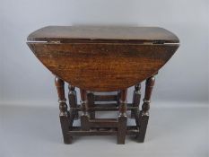 A Small Oval Drop Leaf Table