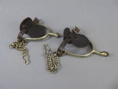 A Pair of Antique Metal and Leather Spurs