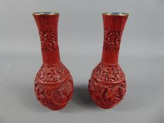 A Pair of Red Oriental Vases.