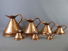 A Set of Seven Victorian Graduating Copper Haystack Measure Jugs