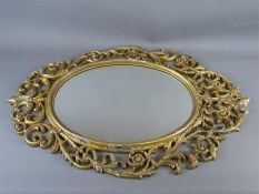 An Oval Gilt-Style Mirror