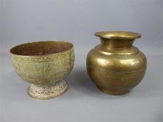 An Indian Bronzed Lota, incised with a peacock