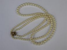 A Vintage Two-Strand Graduated Cultured Pearl Necklace