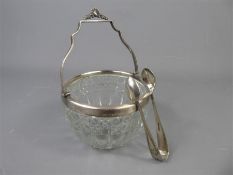 A Cut Glass and Silver Rimmed Sugar Bowl