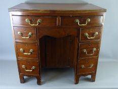 An Antique Mahogany Bow-Fronted Kneehole Desk