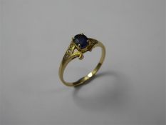 A 14 ct Yellow Gold Sapphire and Zircon Ring