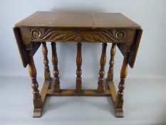 An Antique Oak Rectangular Drop-Leaf Side Table