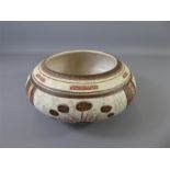 A Stoneware Inverted Rim Bowl with cream/red/brown decoration