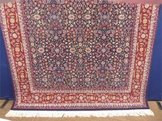 A Signed Woollen Hereke Carpet