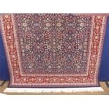 A Signed Woollen Hereke Carpet