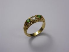 An 18ct Yellow Gold, Diamond and Green Stone Ring