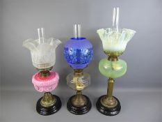 Three Late Victorian Cut-glass Oil Lamps