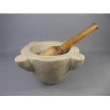 An Antque Mortar and Wood-Turned Pestle.