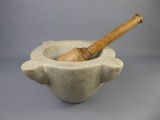 An Antque Mortar and Wood-Turned Pestle.