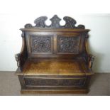 An Antique Carved Oak Settle