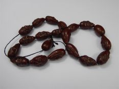 A Chinese Carved Face Bead Necklace