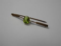 An Antique 9ct Peridot Bar Brooch