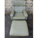 A Vintage G-Plan Leather Armchair and Footstool