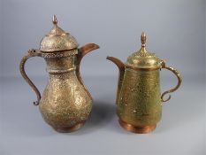 Two Islamic Copper Lidded Ewers