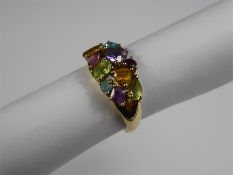 A 9ct Yellow Gold Amethyst, Citrine, Peridot and Blue Topaz Ring