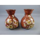 A Pair of Circa 1895 Doulton Lambeth Ware 'Michaelmas Daisy' Faience Ewers