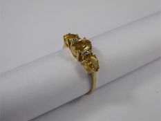 A 9ct Yellow Gold Beryl and Diamond Ring