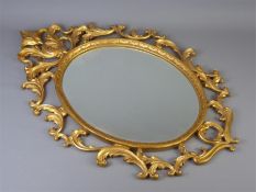 A 20th Century Gold-Painted Framed Oval Mirror