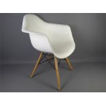 Four White Plastic Tulip Chairs